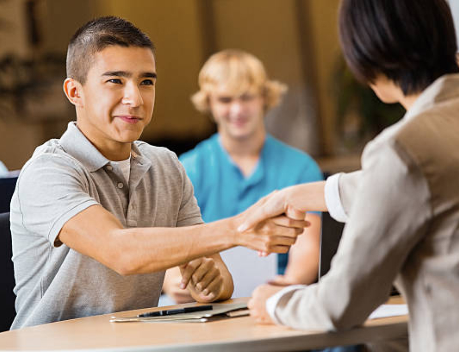 Business student shaking hands