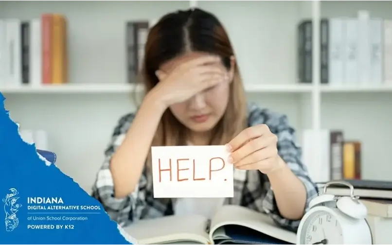 Student with a "help" sign