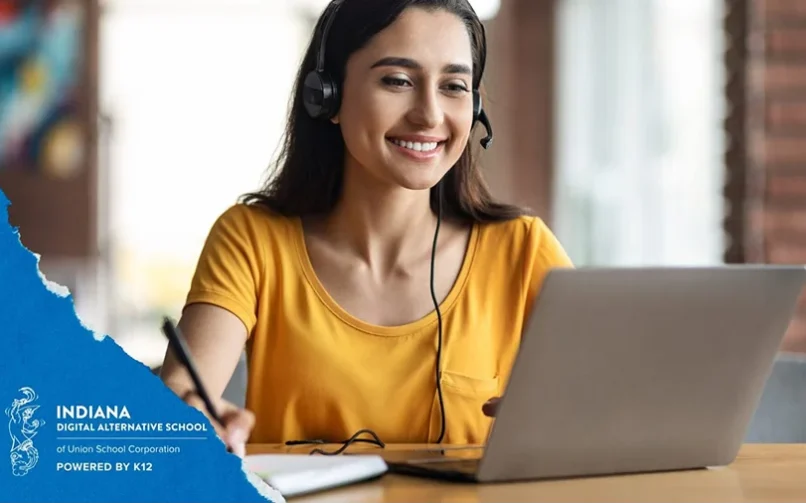 Student wearing a black pair of headphones