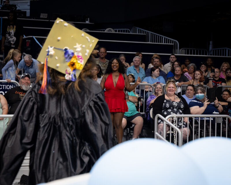 people looking the students at graduation