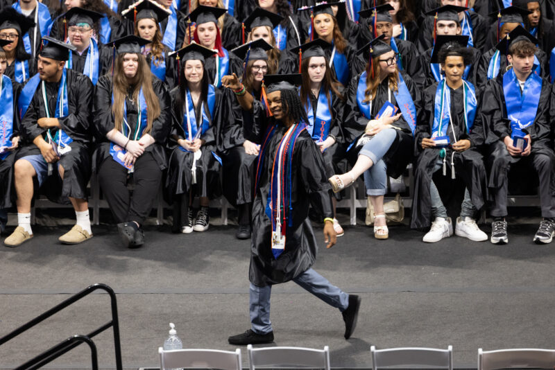 boy walking at the graduation